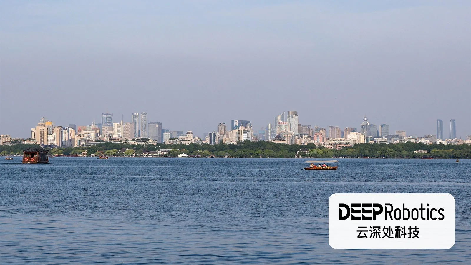 Hangzhou's skyline over West Lake, with the DEEP Robotics logo