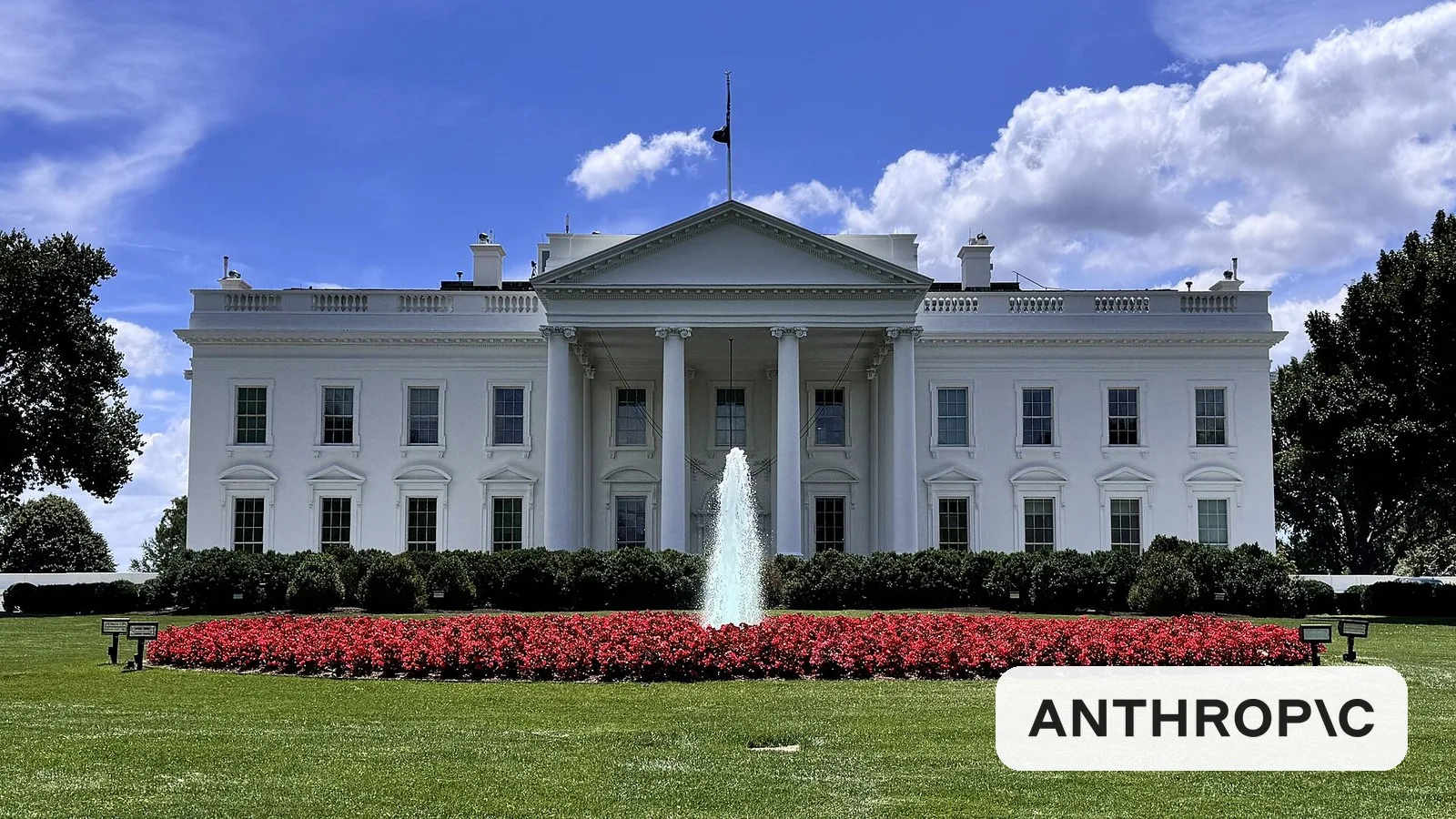 The White House north facade with the Anthropic logo